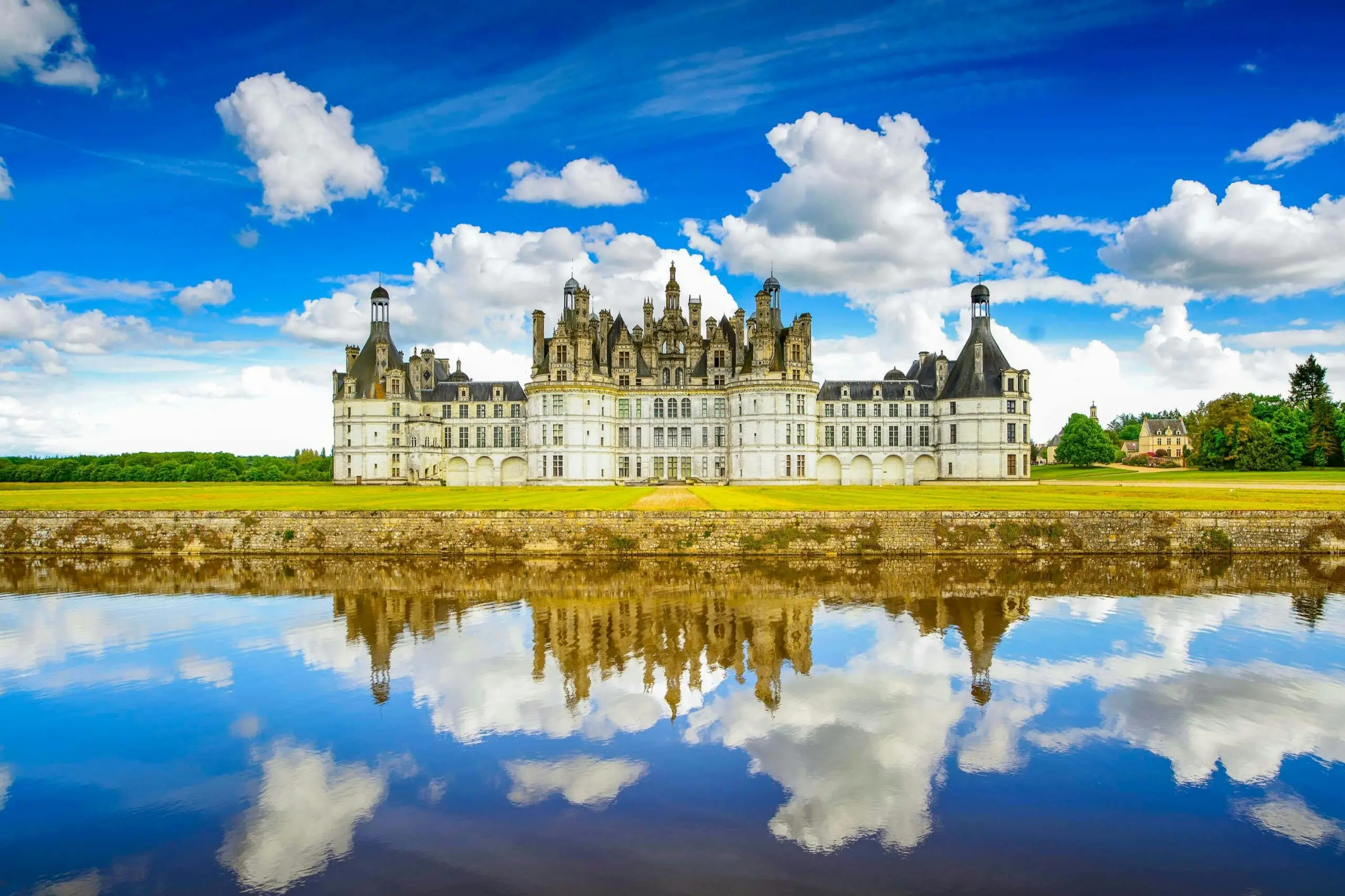 Château de Chambord reflected in still water, a grand French castle.
